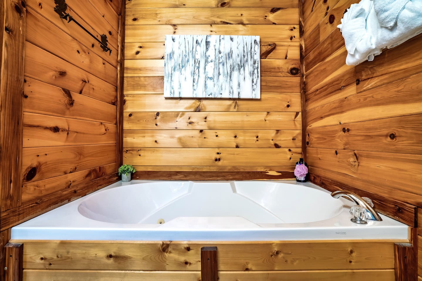 Modern master bathroom featuring a jetted tub, perfect for relaxing, soaking, and enjoying a peaceful mountain getaway.