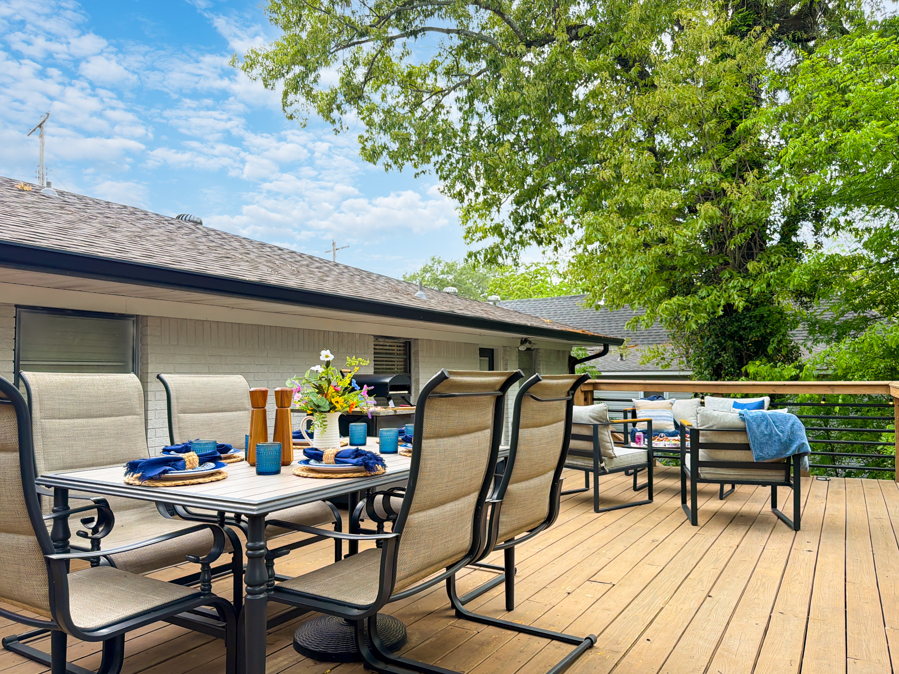 On the other side there’s an additional dining table and a BBQ grill.