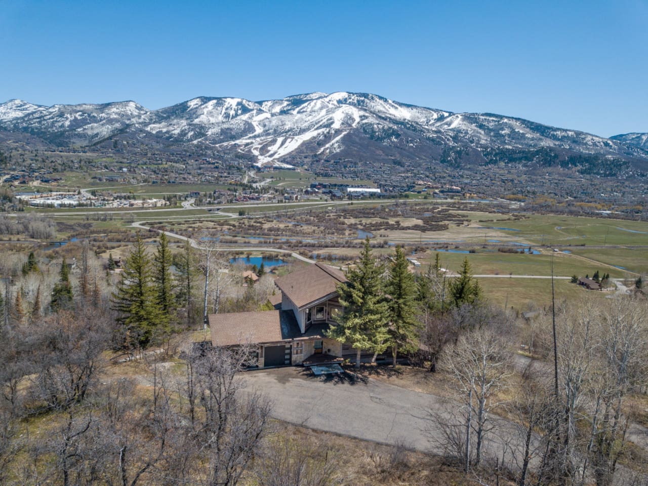 Aerial Shot of House with Steamboat Resort in Background