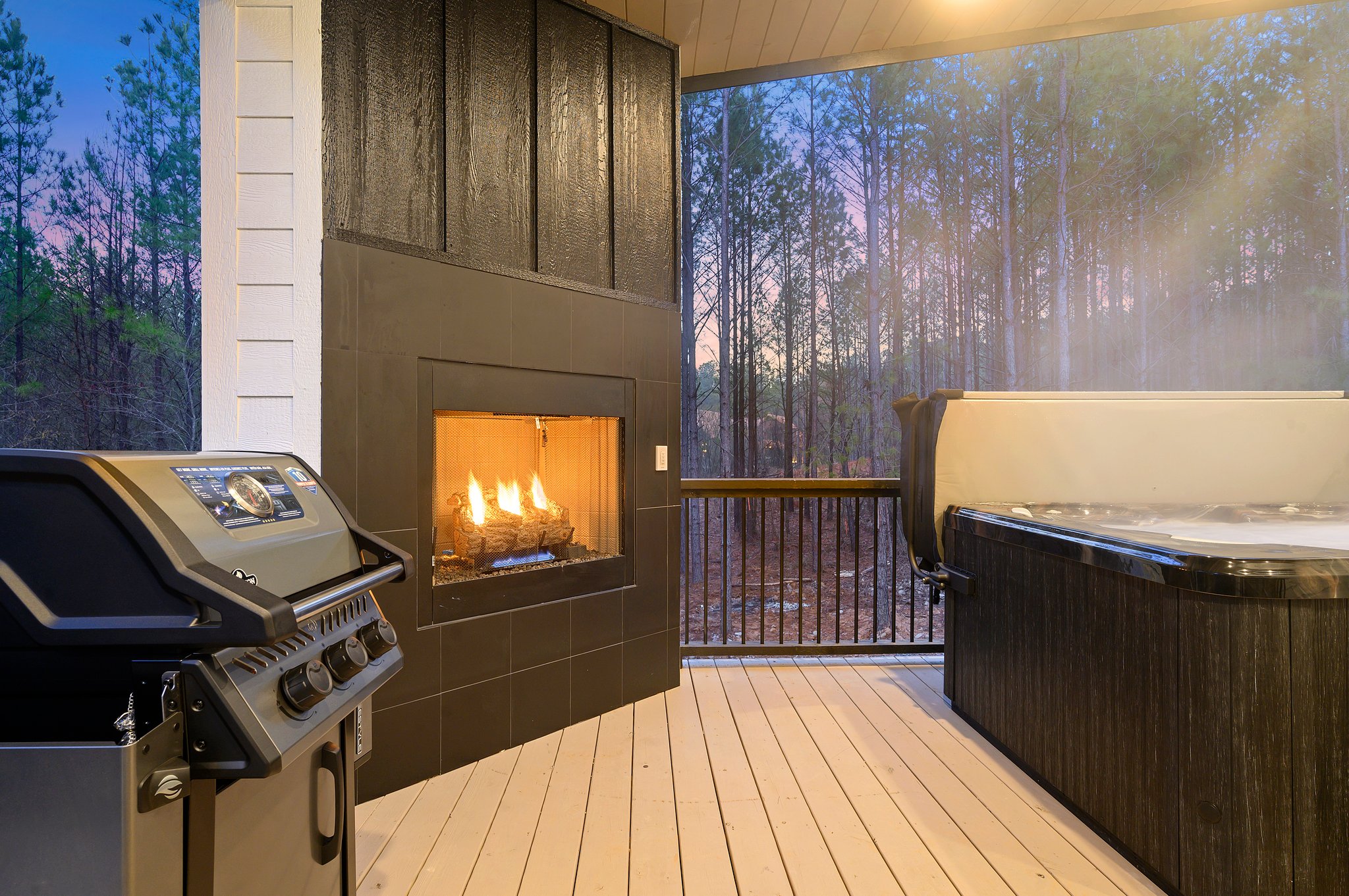 Unwind fireside on the screened porch, where forest views meet modern comfort.