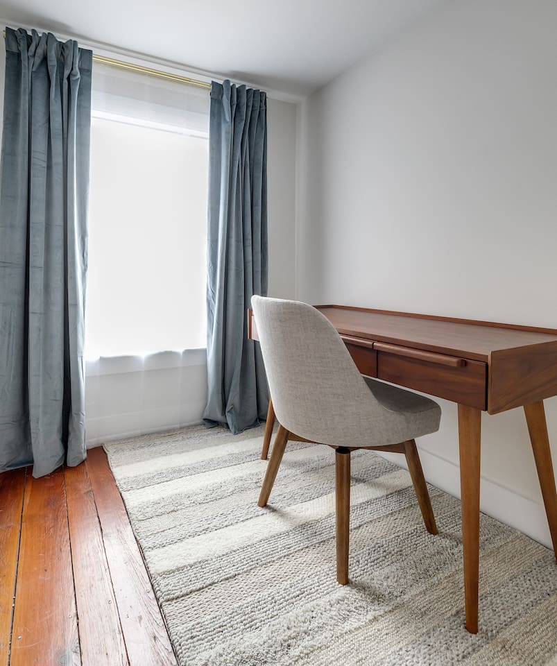 Workspace: Bright workspace with stylish desk and calming views for productive stays!