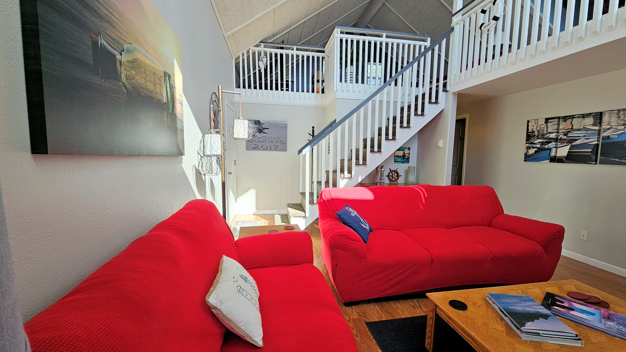 main floor living room with door to deck and garage