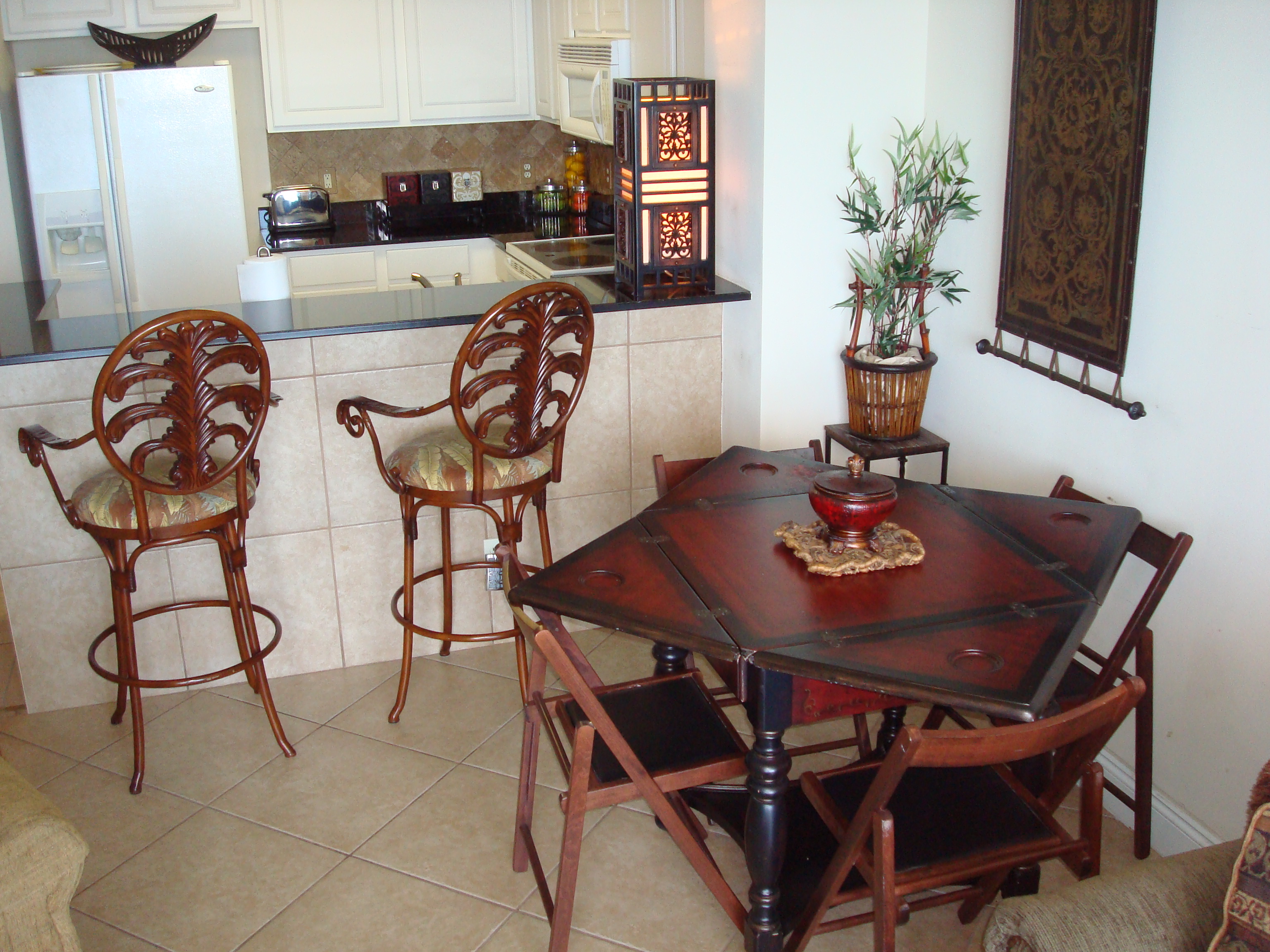 The dining table folds out for expanding seating & there's also a breakfast bar