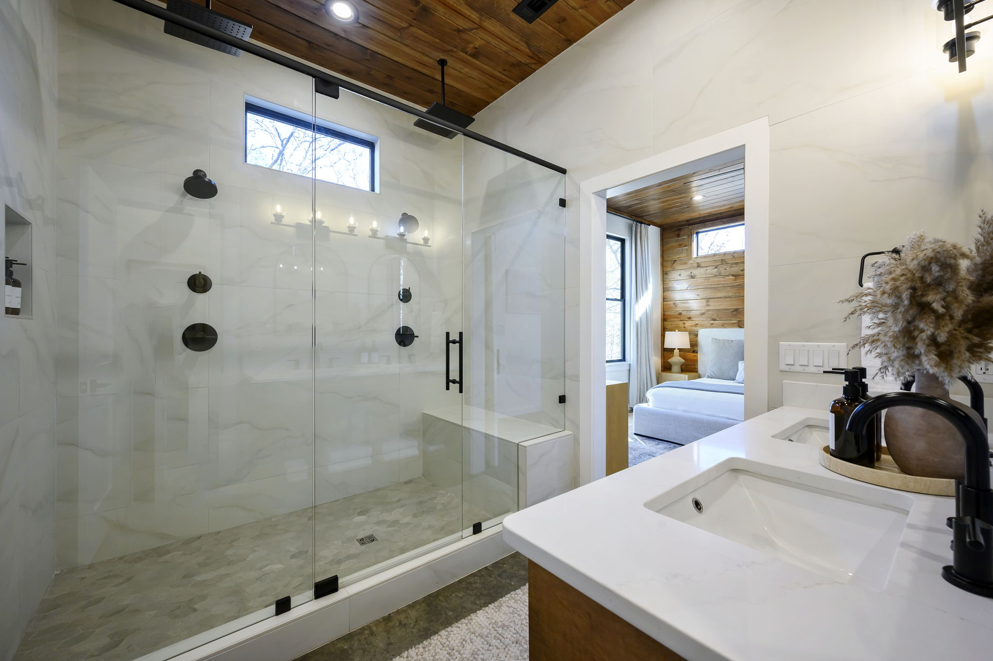 Ensuite Bathroom 3 - Attached to King Suite 3. Featuring enormous rain shower with quad showerheads, and spa-quality marble finishes. Includes premium toiletries (body wash, shampoo, conditioner, hand soap) and hotel quality towels. 