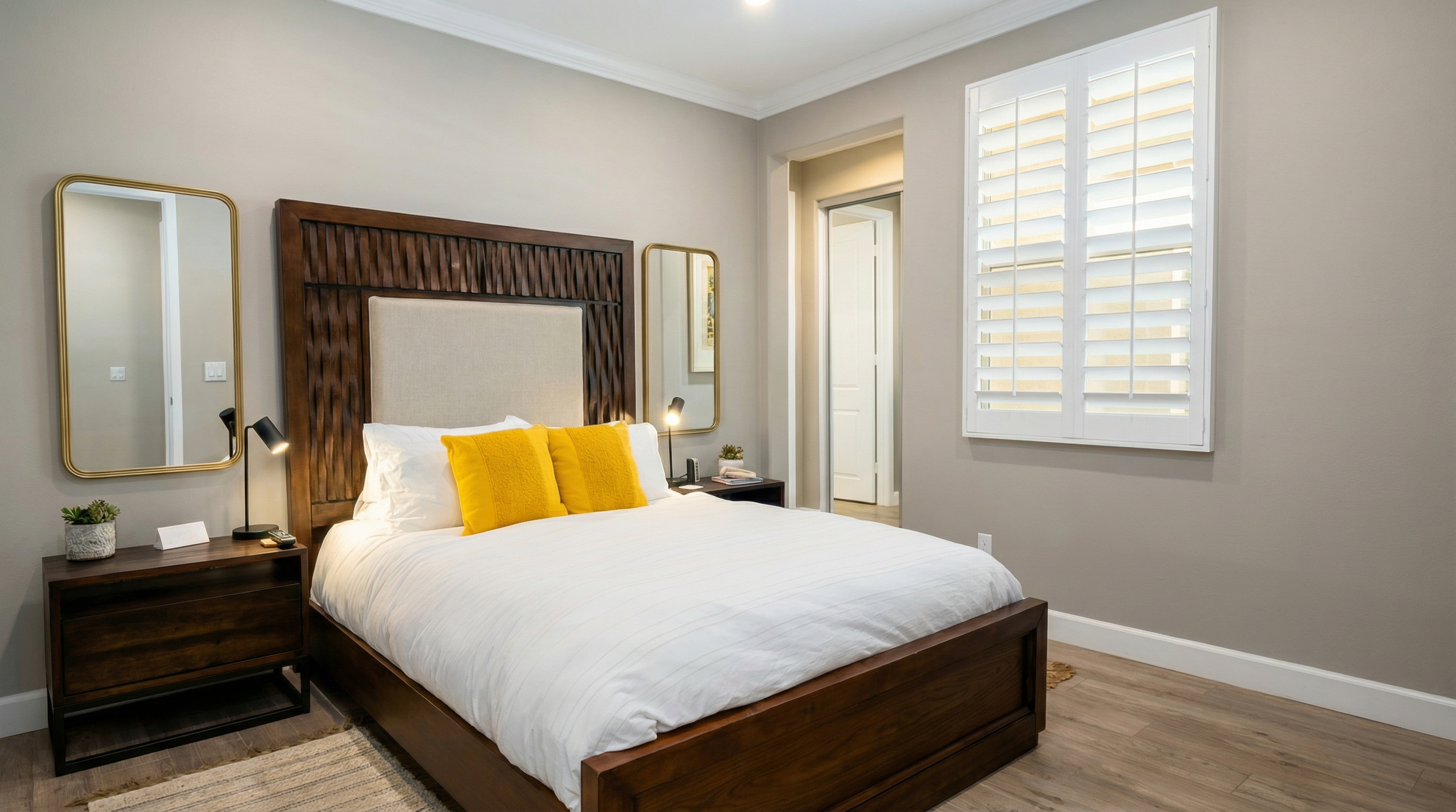 First-floor primary suite features a queen bed, smart TV, ceiling fan, closet and an ensuite bathroom with walk-in shower. (Sleeps 2)