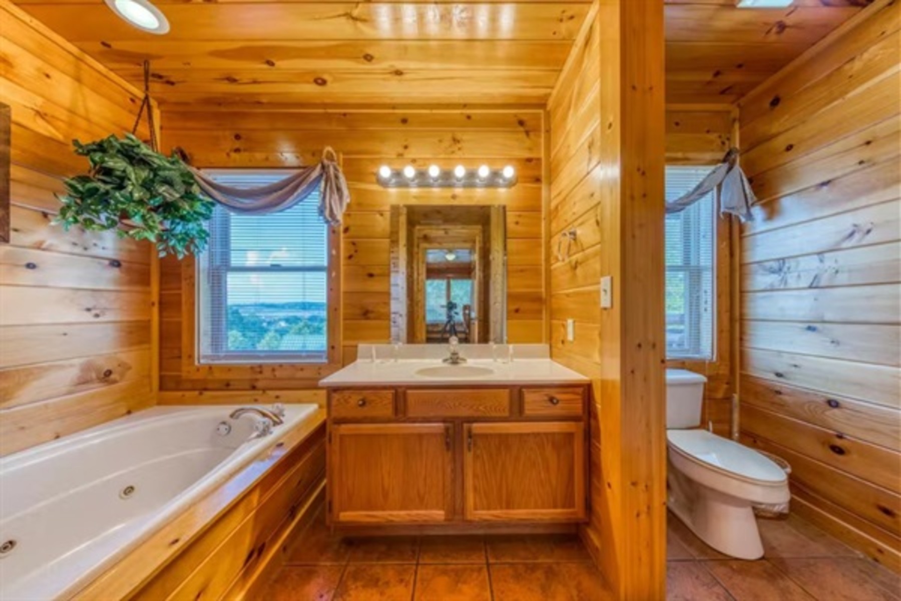 Unwind in a private ensuite bathroom with a jetted tub that invites long soaks after full days together.