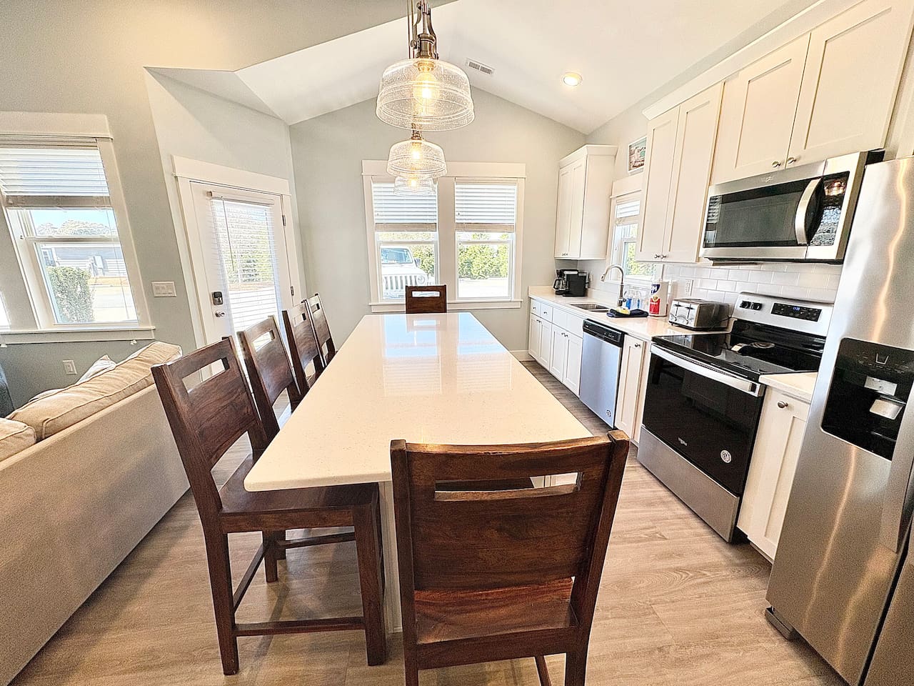 Dining area and kitchen island with seating for guests
