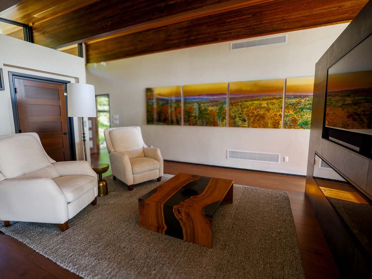 Primary Suite sitting room &mdash; second angle, warm linear fireplace