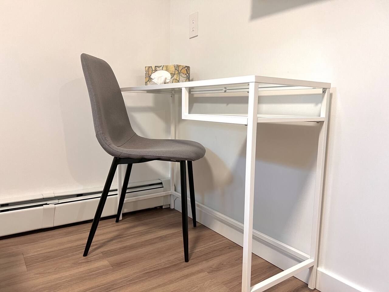 Dedicated workspace located in the bedroom with desk and chair.