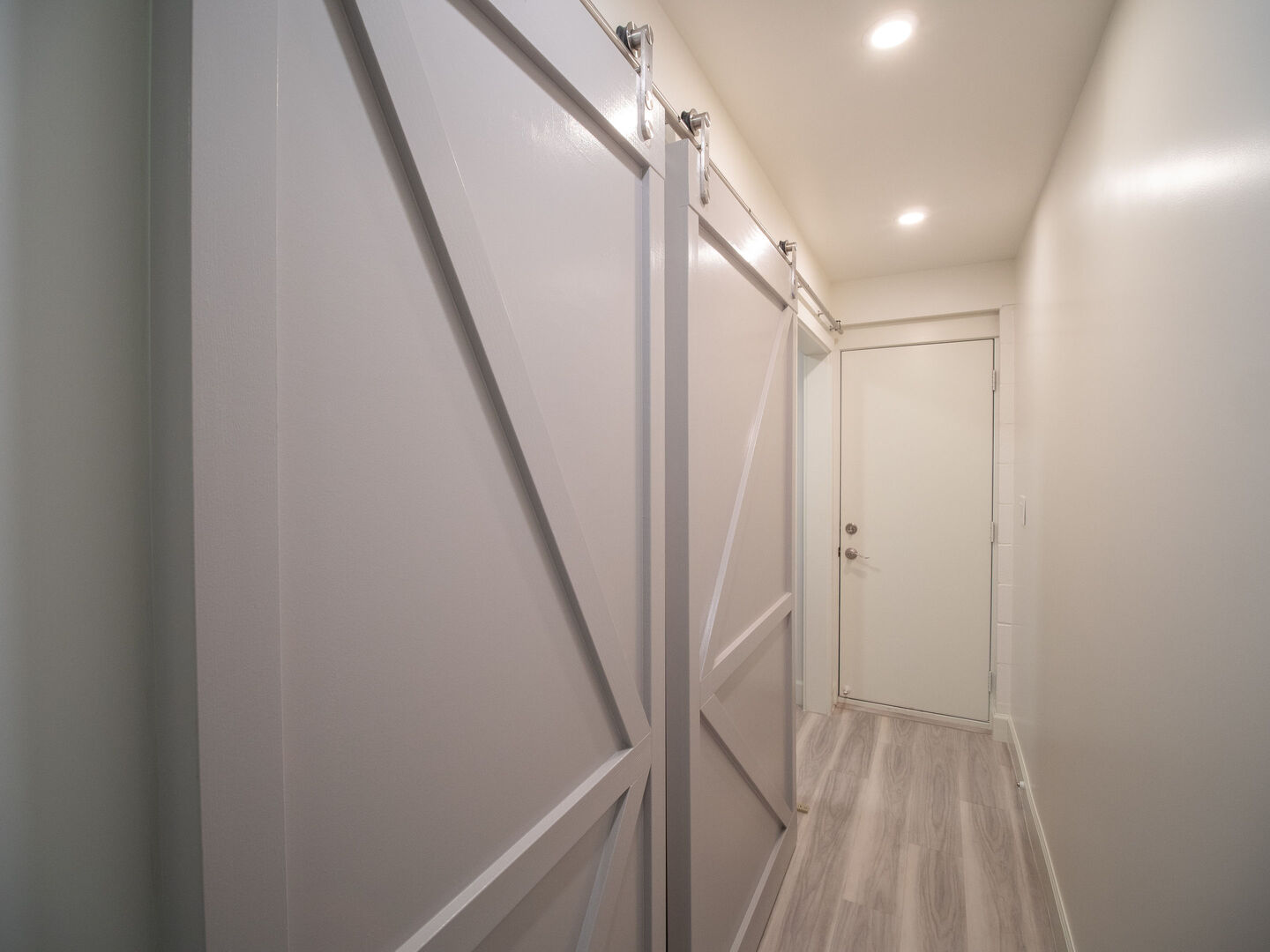 Hallway to laundry room with pantry