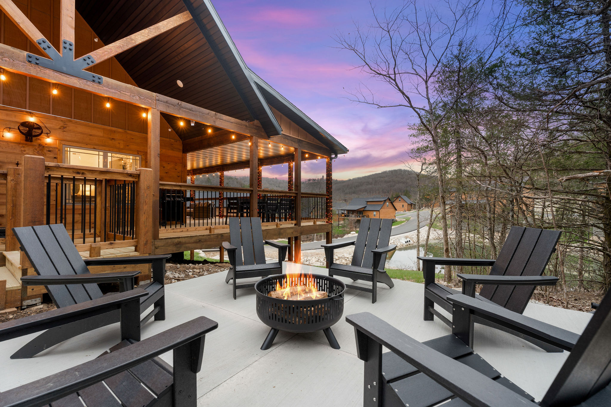 Comfortable seating around the fire pit with scenic views at sunset.