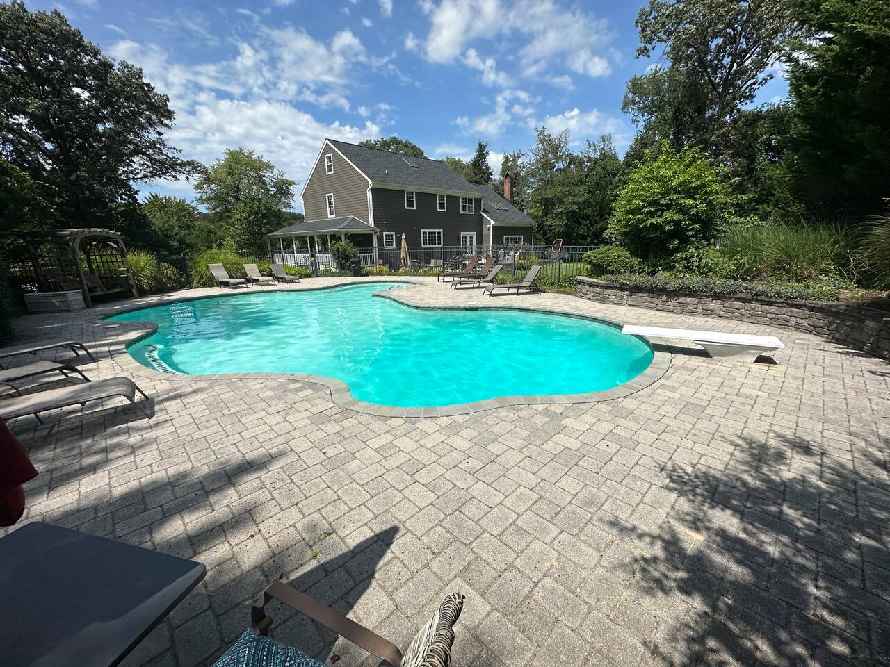 Curved pool has lots of seating area, and areas to sit in the pool while watching others (diving end side left, and circular cove in the back)