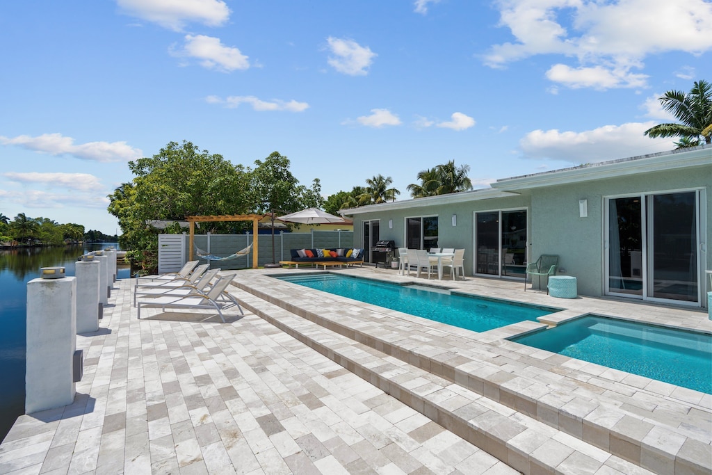 Sunbathe, lay in the pool on a provided floatie, relax in the hammock or spa.