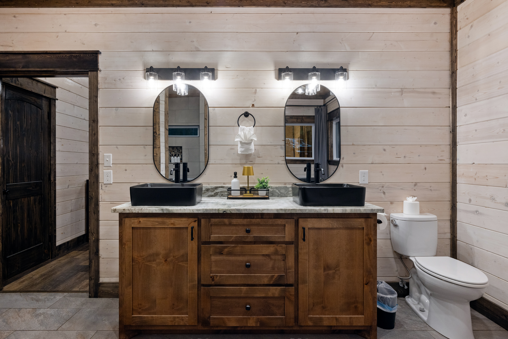 No fighting for counter space here. The double vanity gives couples room to get ready together without giving up the relaxed pace of the weekend.