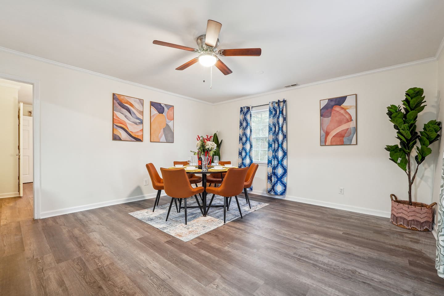A dining area featuring a dining table set and a bar counter with four bar chairs — perfect for enjoying meals or casual drinks.
