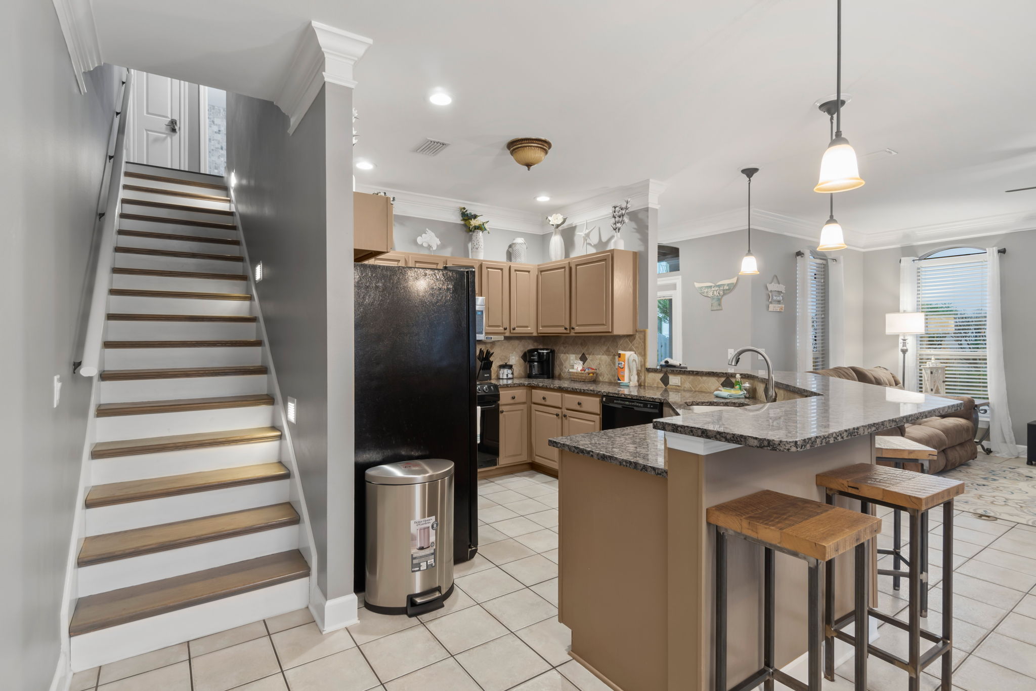 View of kitchen leading to upstairs