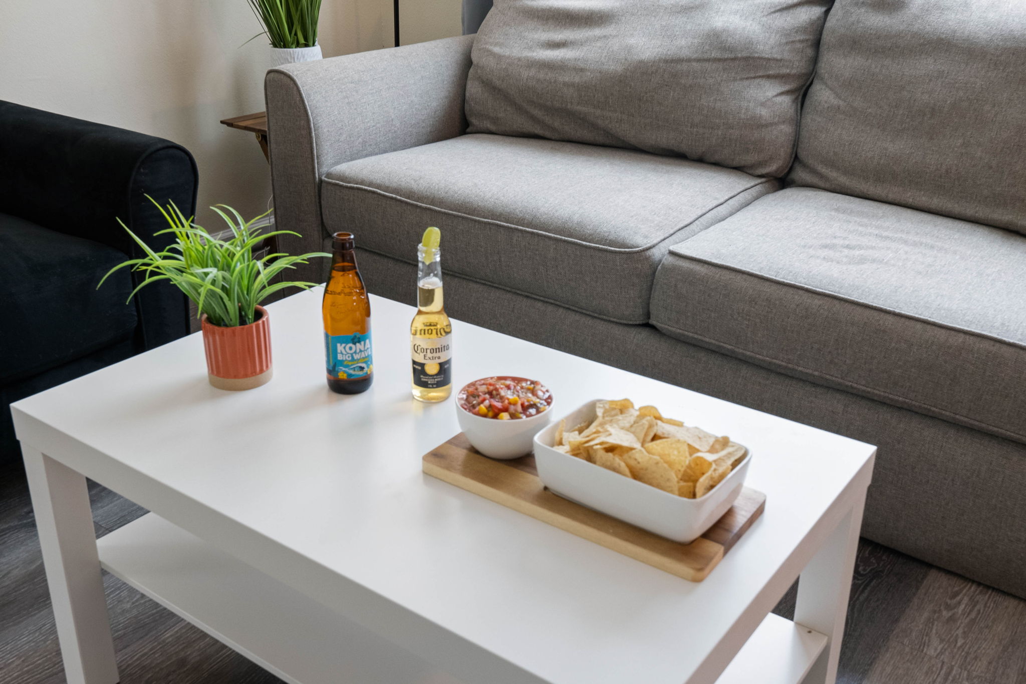 Floral artwork and small potted plants add a calm, organic feel to the space.