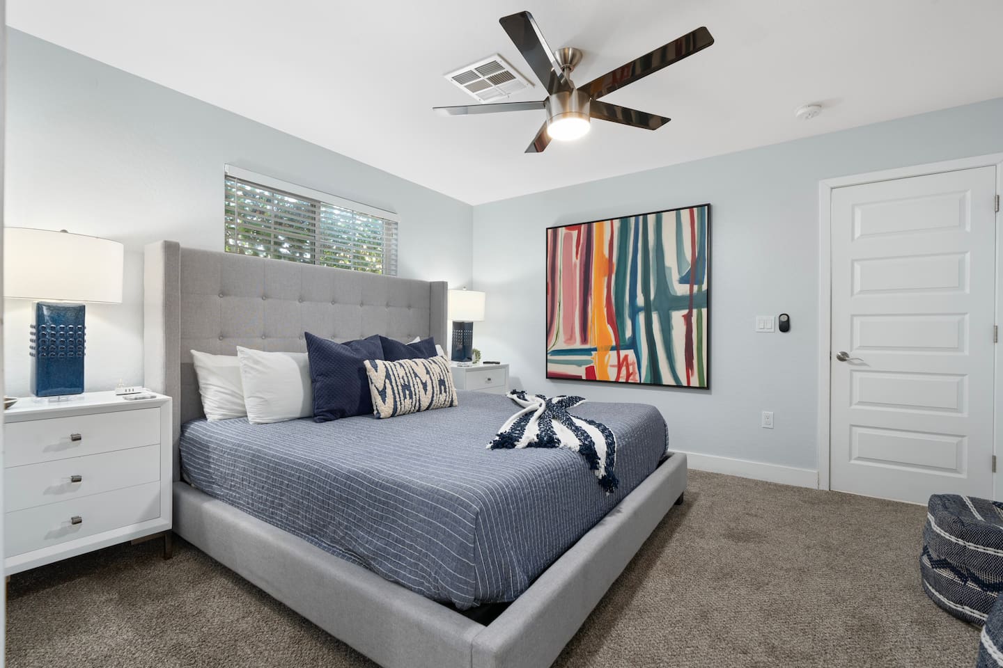 Spacious bedroom with a warm, inviting ambiance, designed for comfort and relaxation.