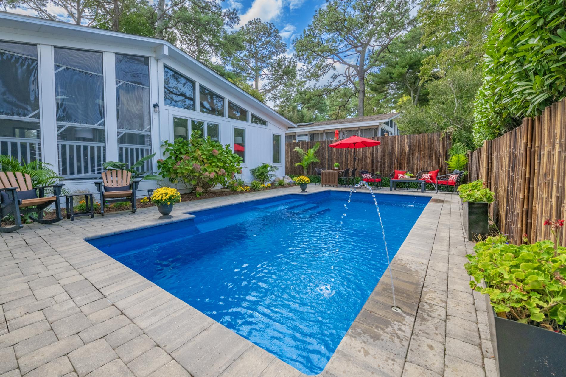 Private pool with seating areas