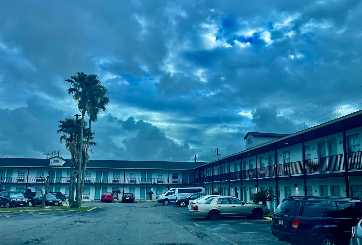 Apartment complex exterior with open parking and easy access around the property.

