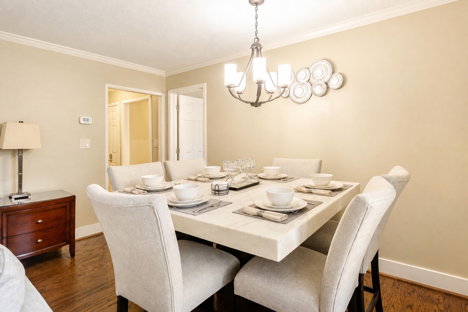 Elegant dining area featuring a beautifully set table with seating for six, perfect for enjoying meals and creating memorable moments together.