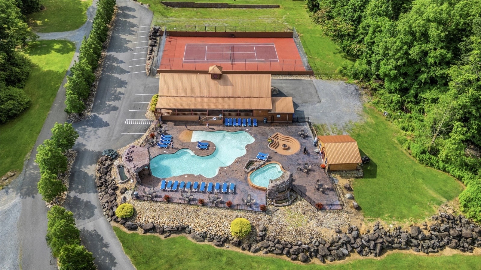 Resort with basketball, pickleball, tennis court, pools, hot tub, fire pit, and gym