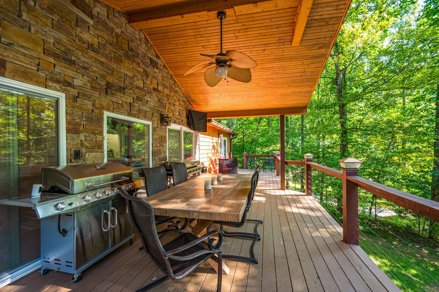Outdoor dining area with gas grill and flat top griddle