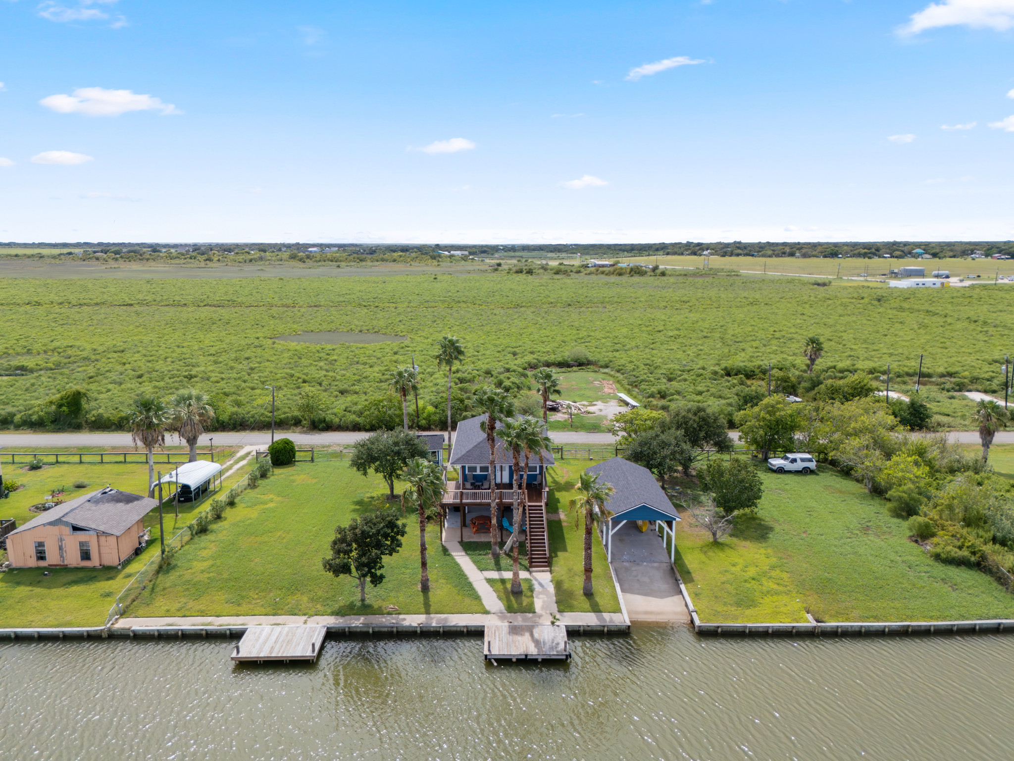 Ariel view of home and pier.