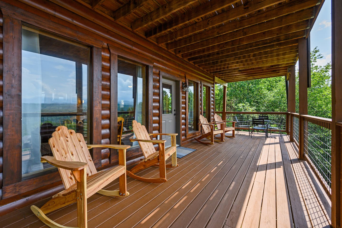 The lower level has Adirondack rockers and two tables and chairs.  