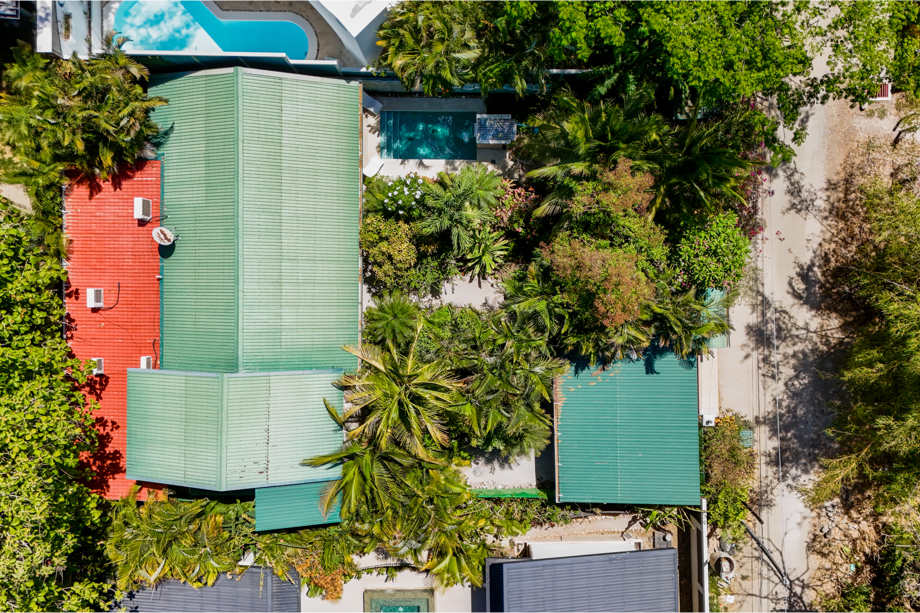 Aerial vew of house and covered parking and private pool