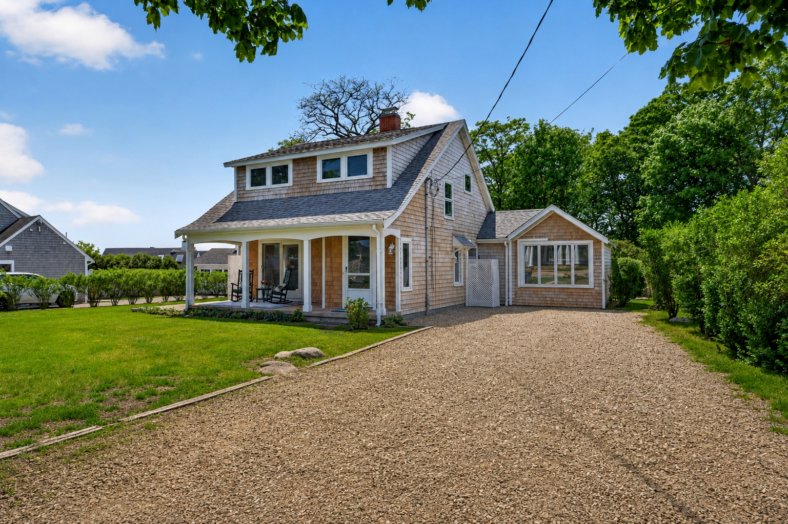 A driveway providing a dedicated paved access area for vehicle parking and entry to the house.