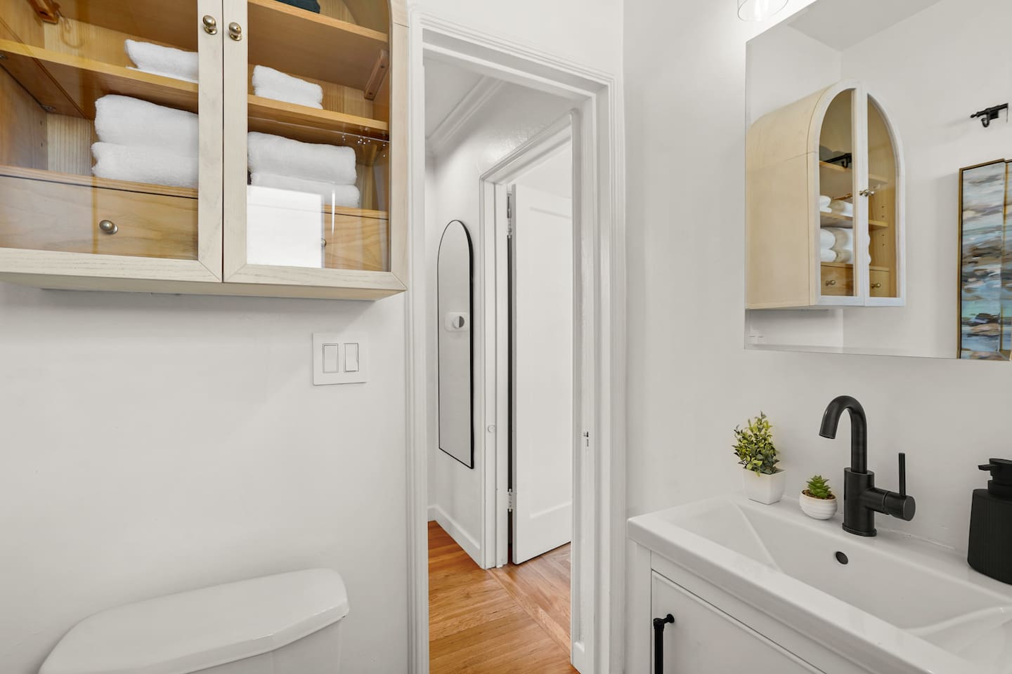 Modern bathroom with sleek finishes, fresh towels, and a clean, relaxing space to refresh during your stay.