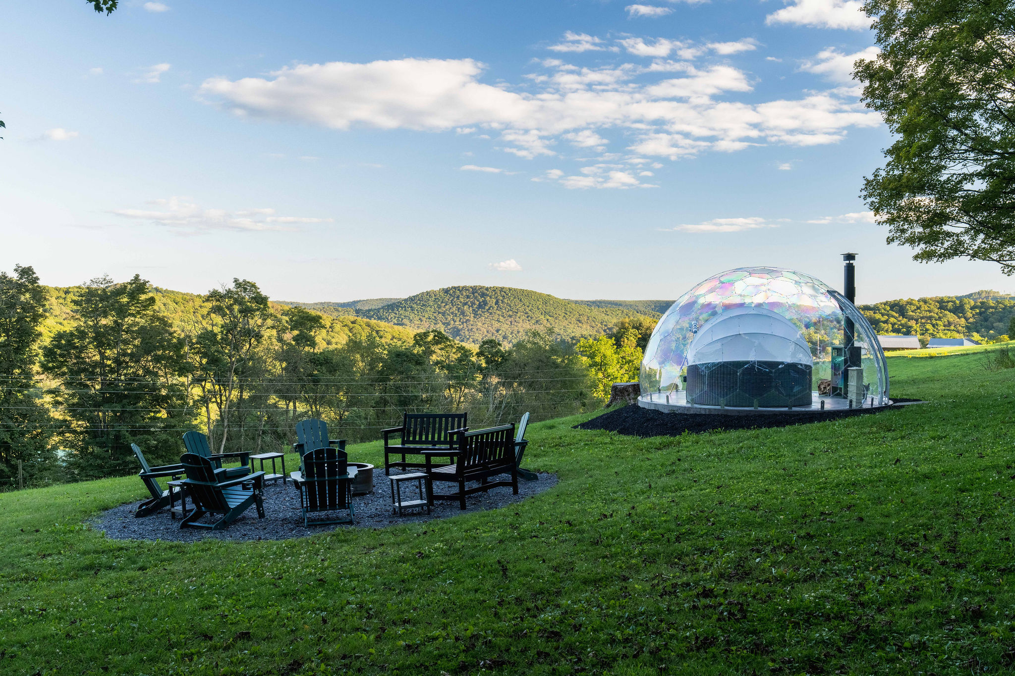 🏔 The dome faces southeast toward the mountains — the best direction for stargazing — with a smokeless fire pit and seating for 10 alongside