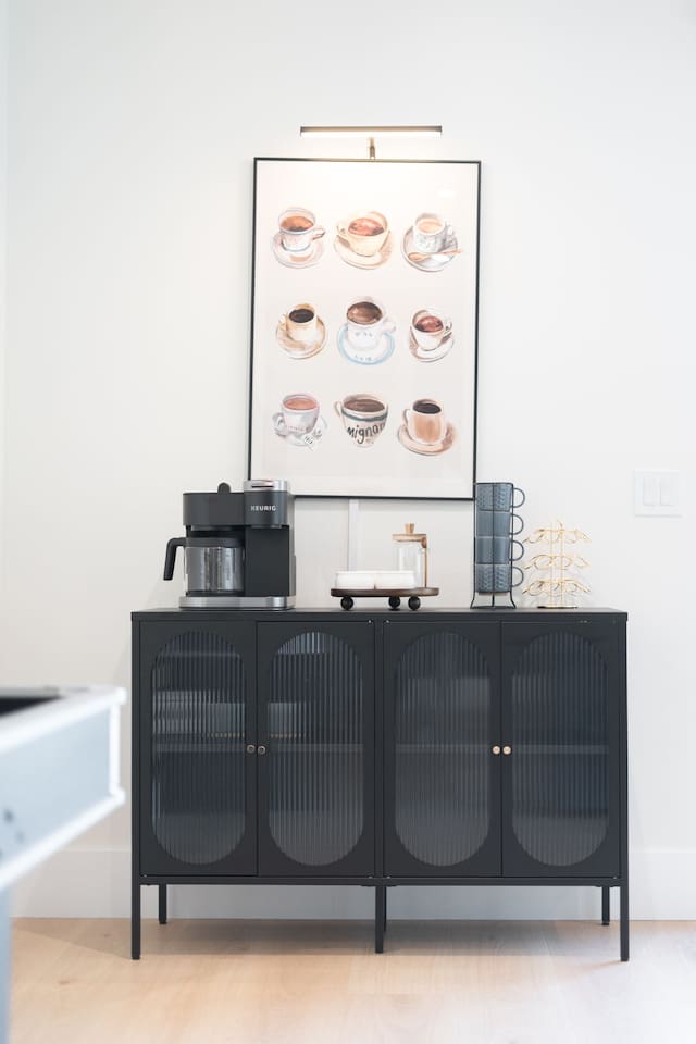 Coffee-inspired wall art adds a cozy touch to the café corner.