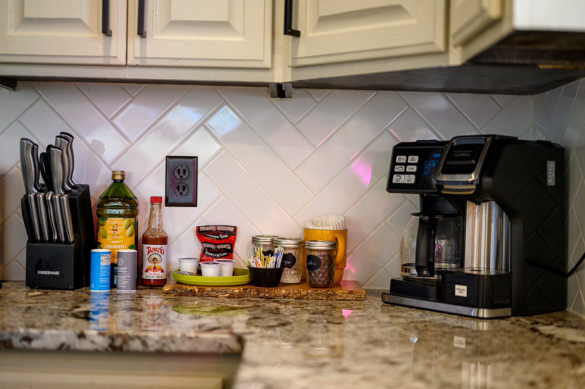 Make your mornings easy with a coffee maker, ground coffee, and pots, pans, slow cooker, rice cooker, bowls, knives, cups, utensils at your fingertips.