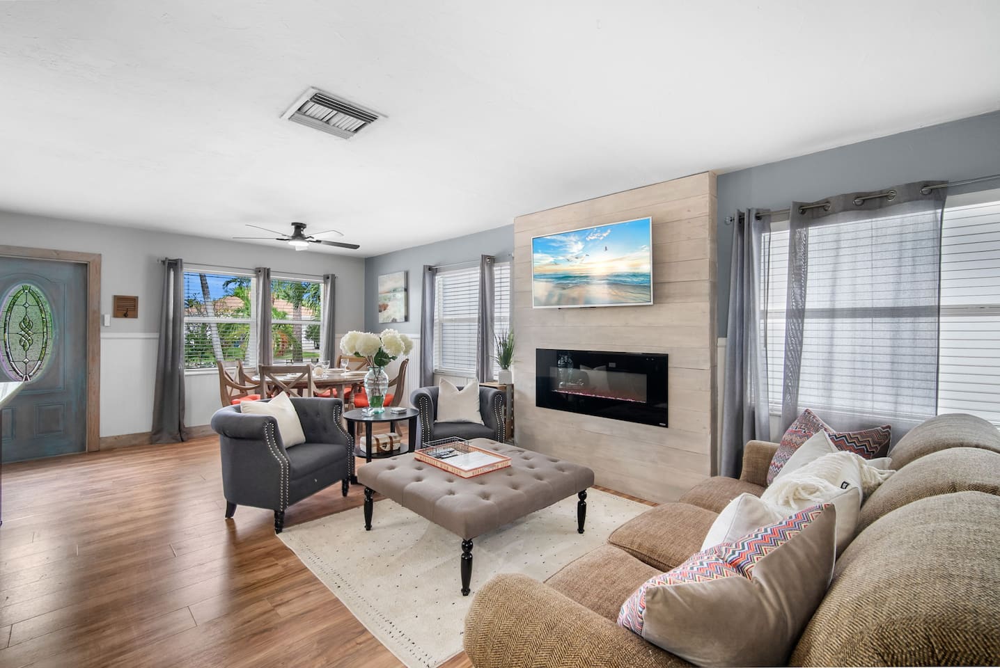 open floor plan featuring a sitting area with a smart TV 