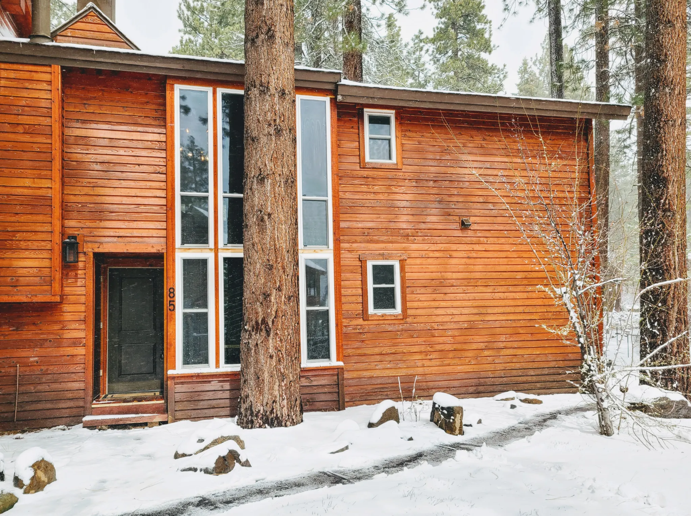 A peaceful winter welcome at Incline85, where fresh snow meets cozy mountain charm.