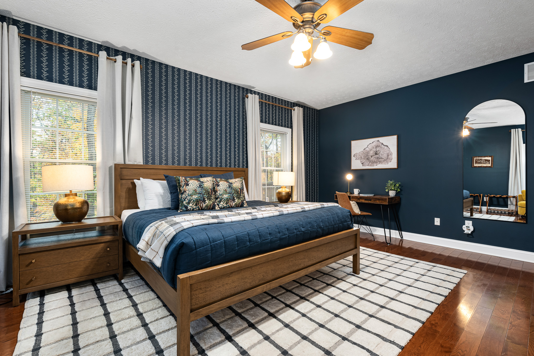 Relax into plush bedding, layered pillows, and calming colors — a peaceful place to recharge.