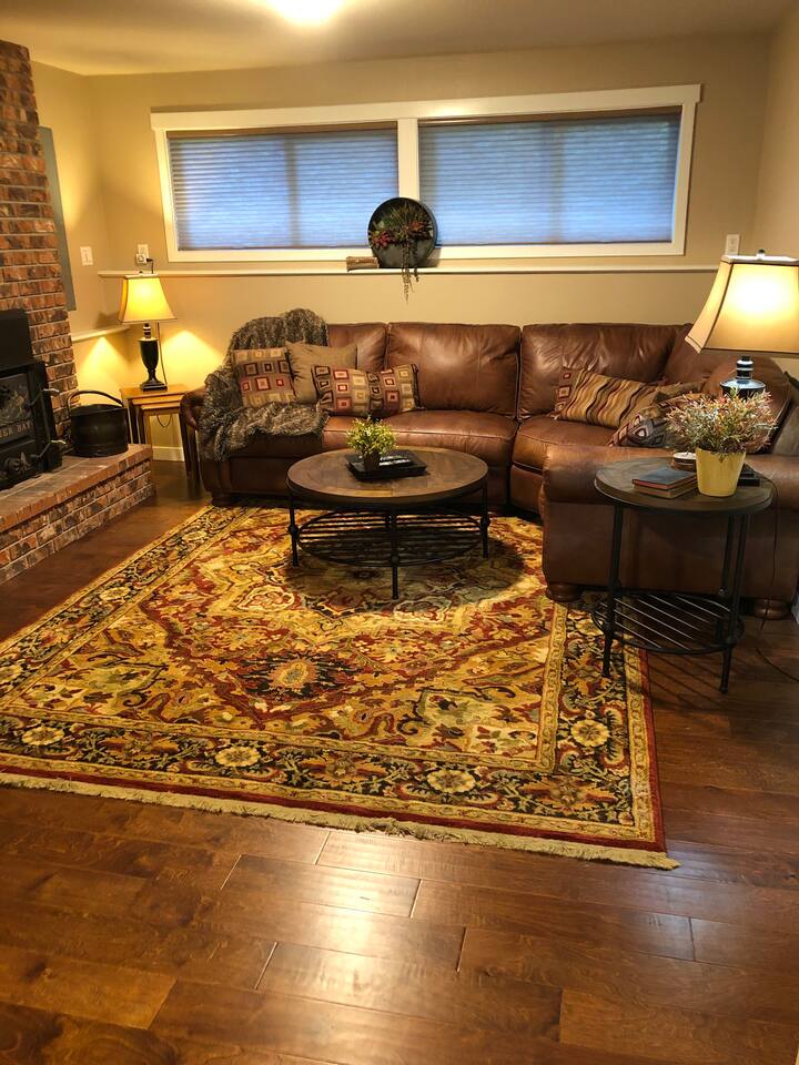Family Room downstairs with wood-burning fireplace.