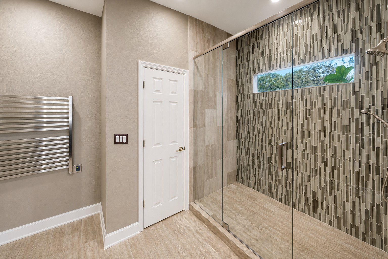 Stylish bath w/ textured stone wall & soft glow.