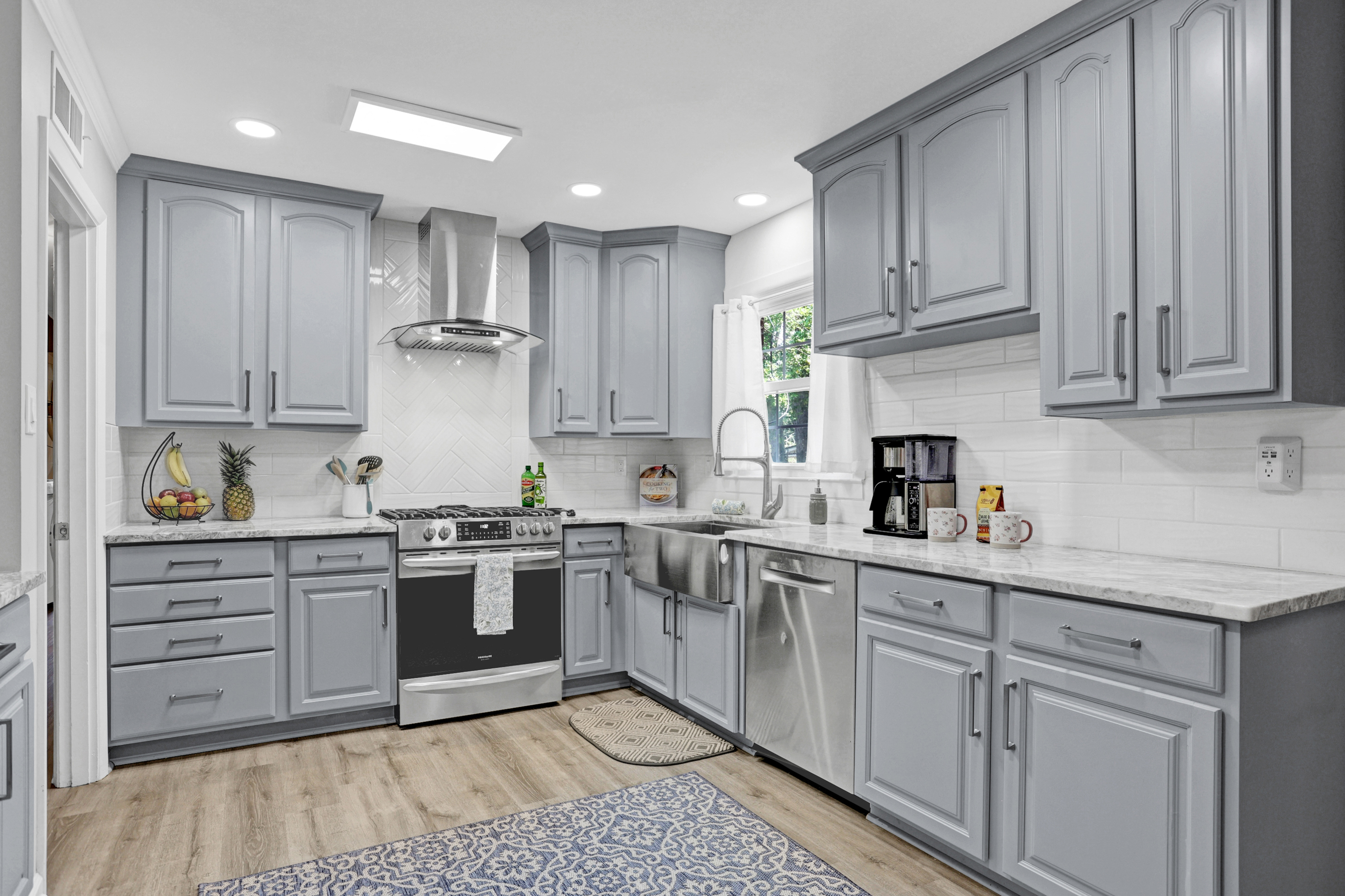 Cook in style with sleek stainless steel appliances and a versatile gas stove—where retro vibes meet modern convenience.