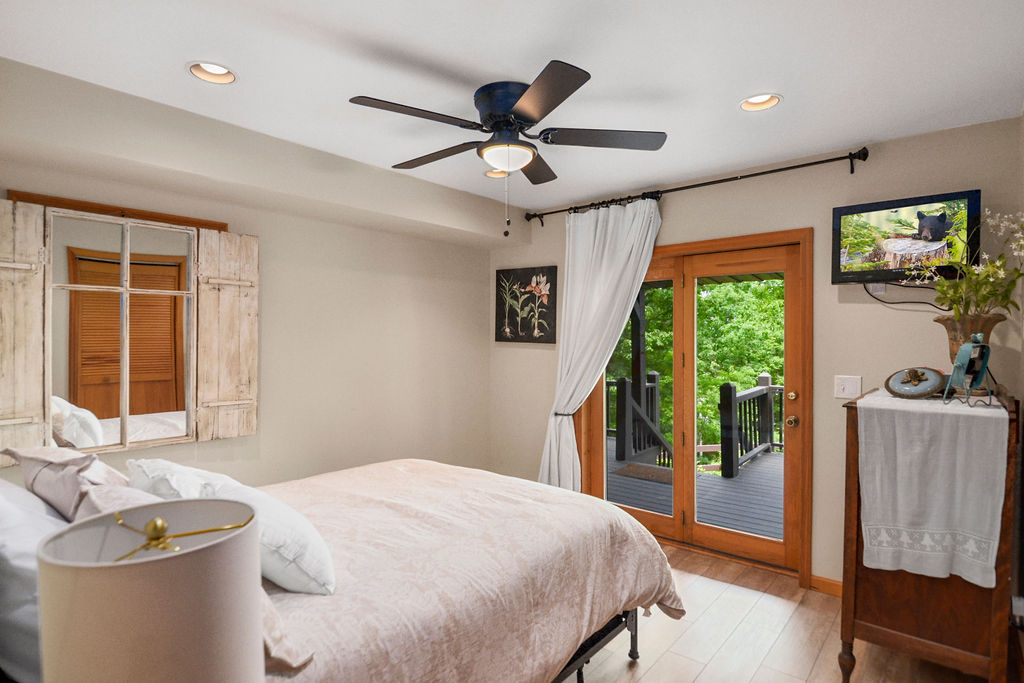 Queen Bedroom with Walkout to Amazing Lake Views