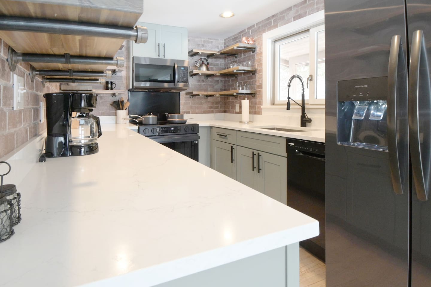 This fully stocked kitchen is ready for family meals and has plenty of space to move around!
