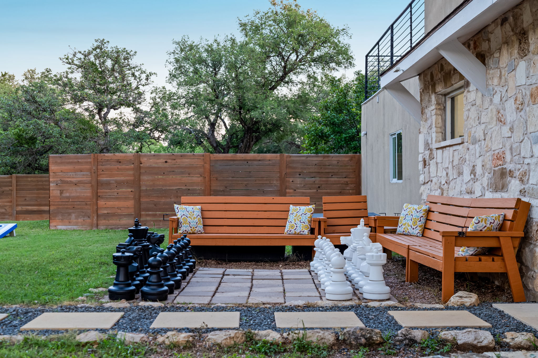Challenge friends and family to a life-sized game of chess while relaxing in the spacious backyard seating area. A fun outdoor setup perfect for group trips, game nights, and enjoying the fresh Texas air.