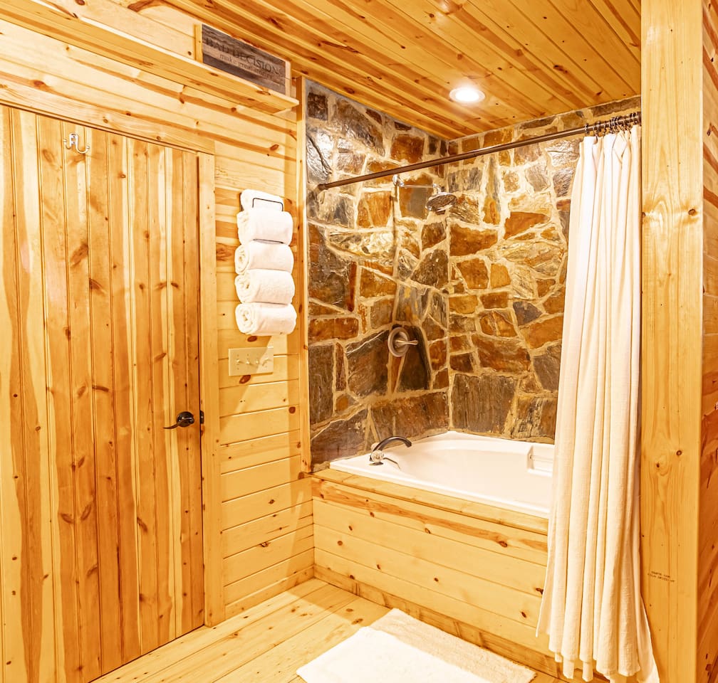 Main floor Master bath ONE with hand crafted stone spa shower