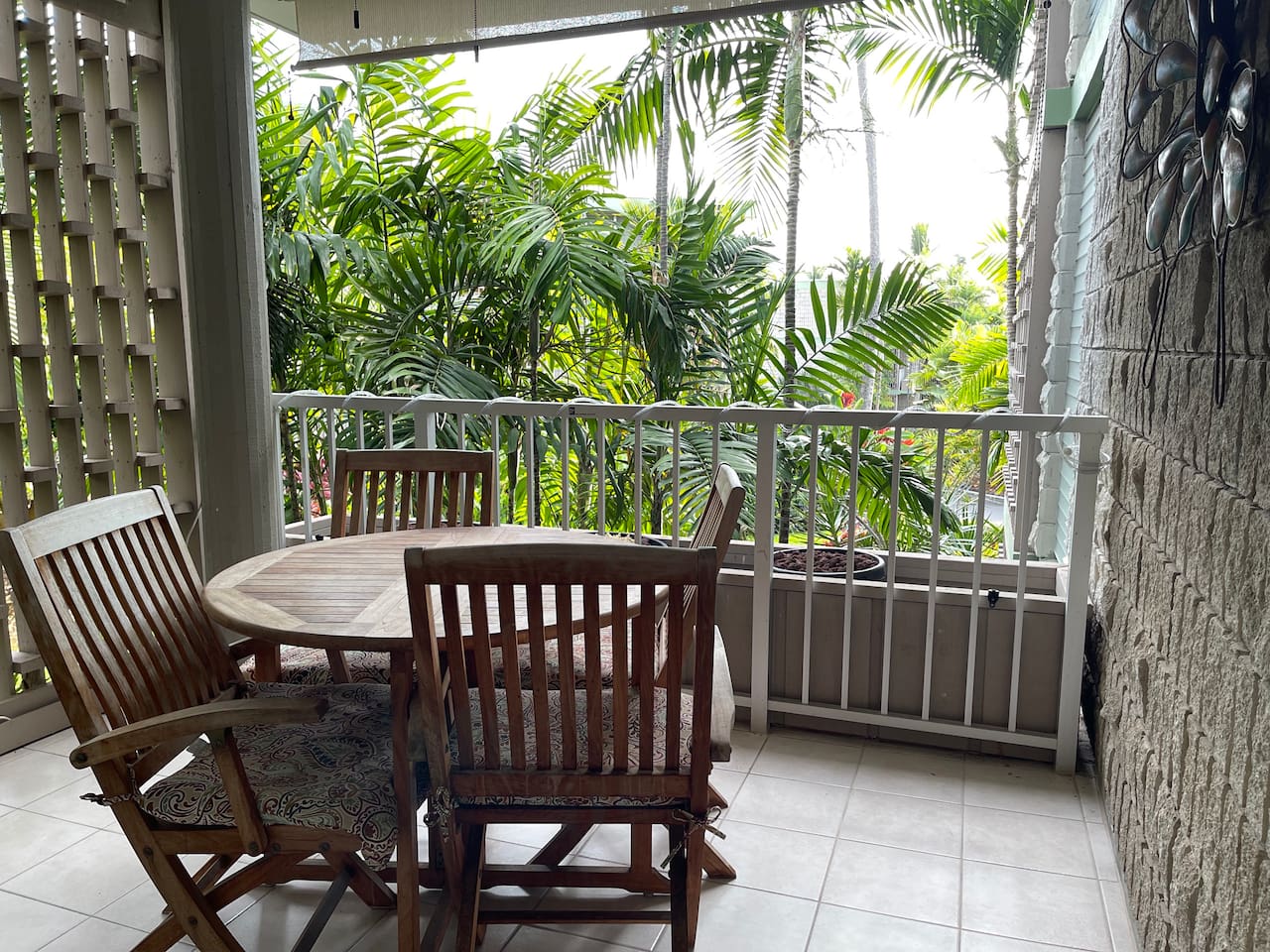 Private lanai surrounded by tropical greenery — ideal for morning coffee or evening relaxation.