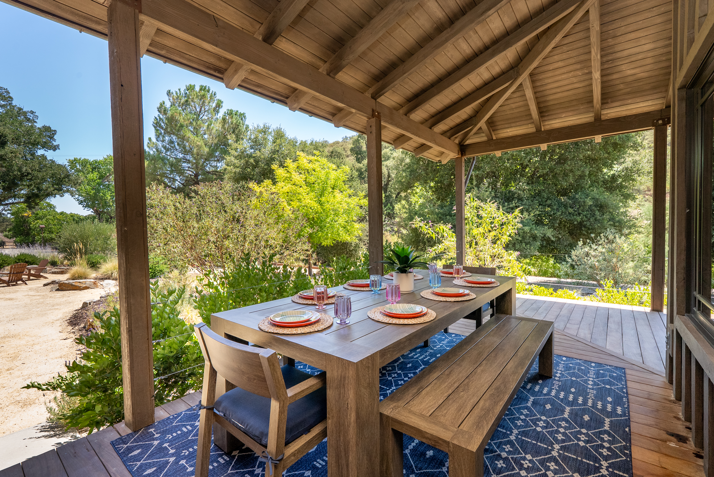 Relaxed covered dining with tranquil oak views.