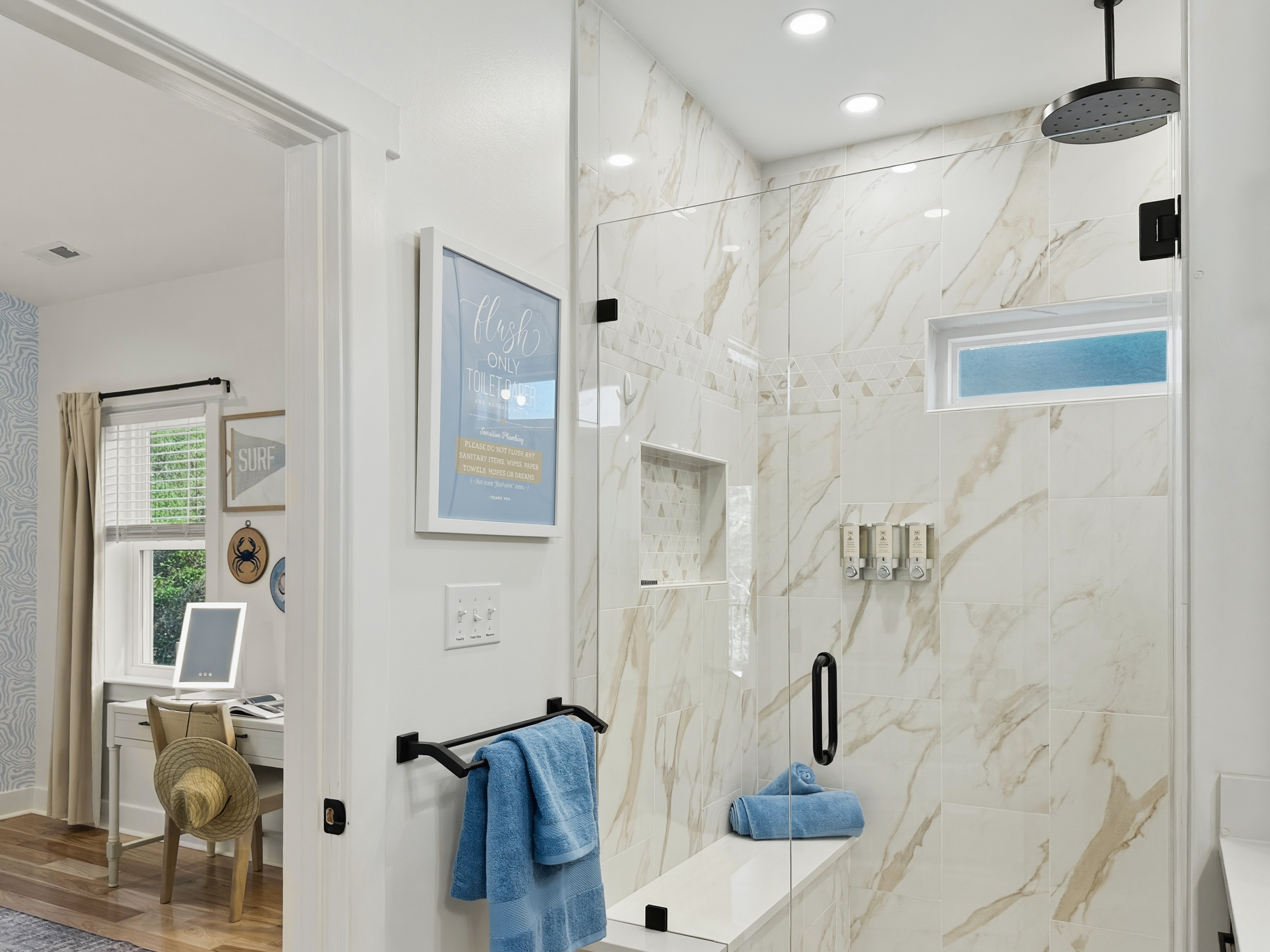 The deluxe en-suite bathroom has a rainfall shower.