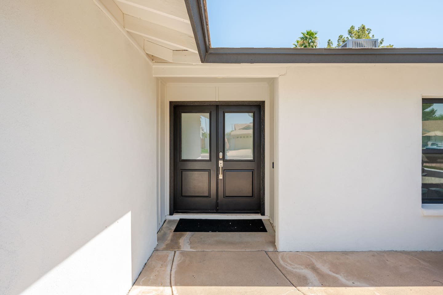Sleek double-door entrance sets the tone for a stylish and inviting stay.

