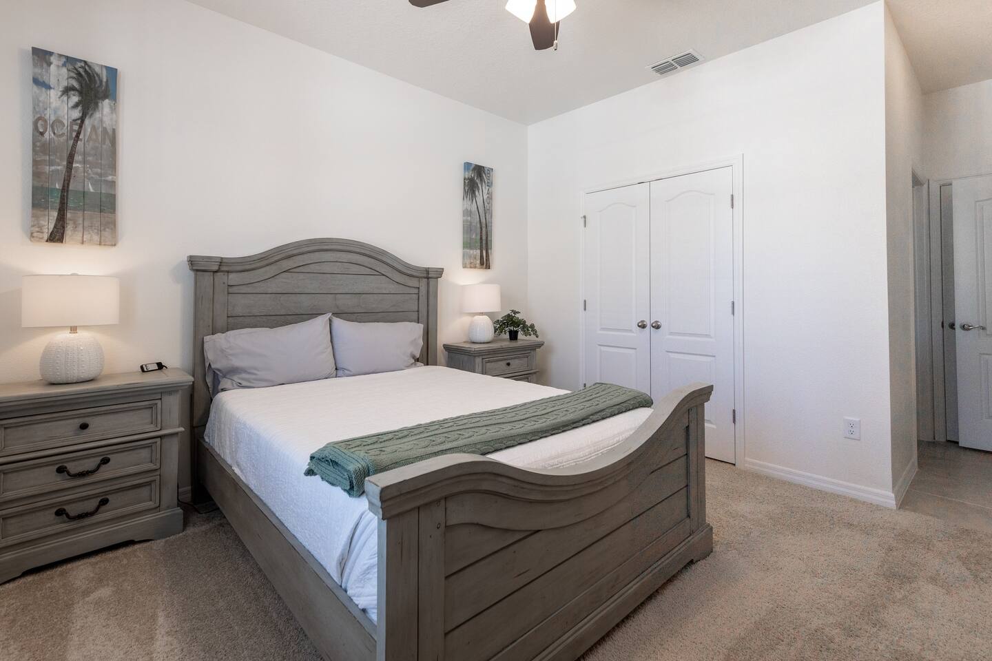 Downstairs Tropical Bedroom with Queen Bed and automatic incline feature. Comes with 70 inch TV and private bathroom and shower. Luggage rack & laundry basket in closet.